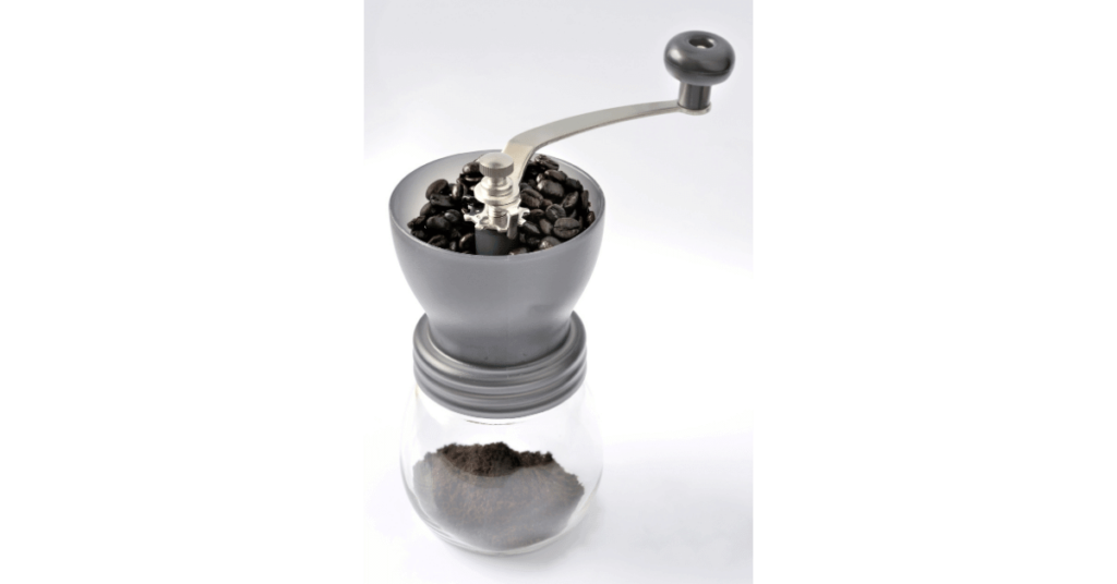 A handheld coffee grinder, perfect for use as a travel grinder