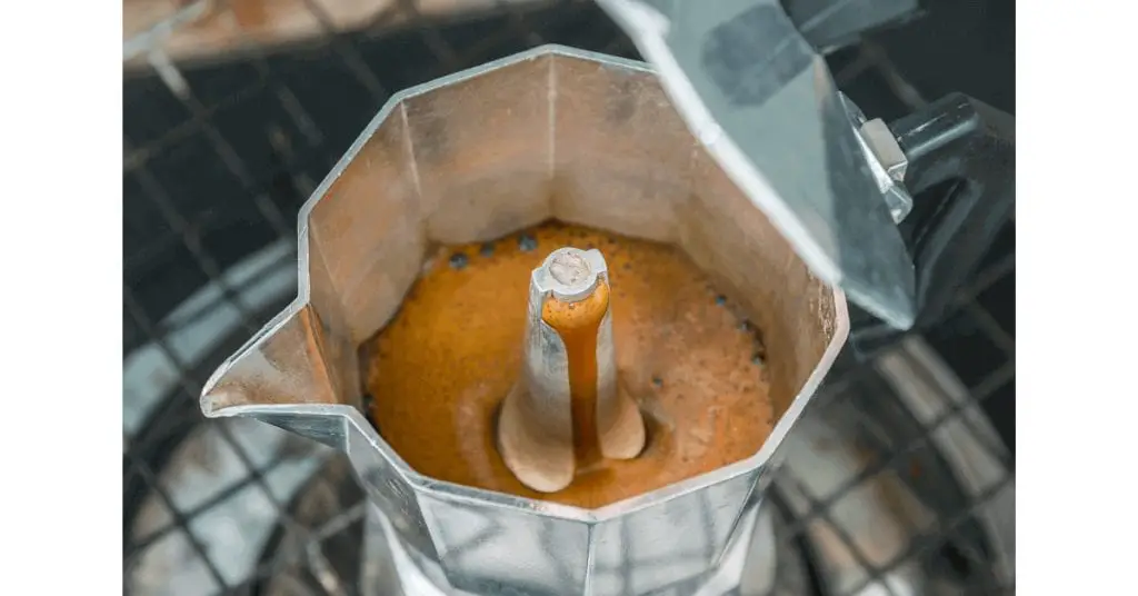 A close-up view of coffee brewing in a percolator