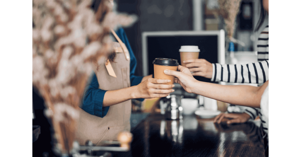 Purchasing a cup of coffee at a coffee shop