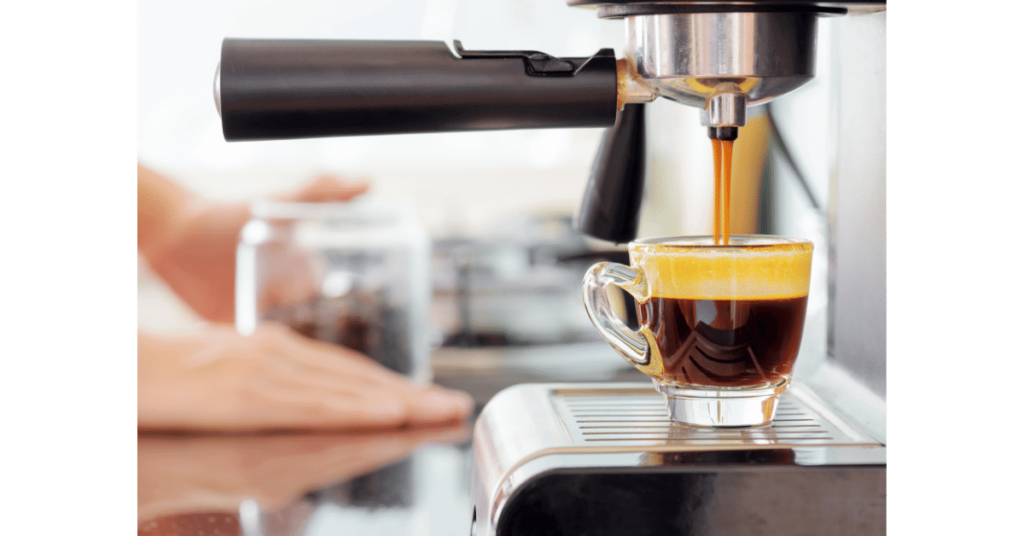 An espresso shot being pulled, possibly to be used as the base for a latte or other espresso drink