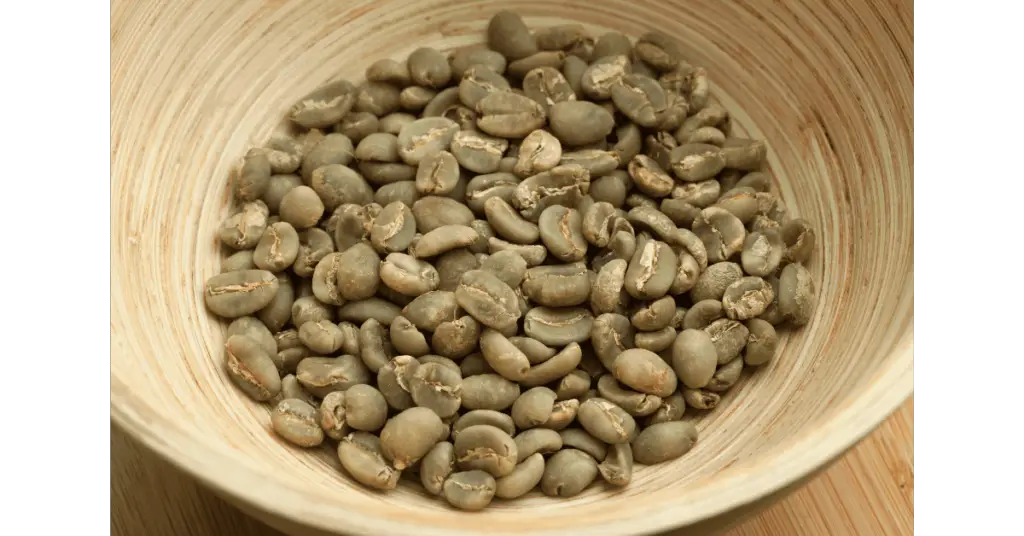 A bowl of green Mandheling beans, a common variety of Sumatran coffee beans