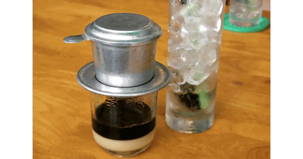 The making of a Vietnamese iced coffee using a Vietnamese coffee filter