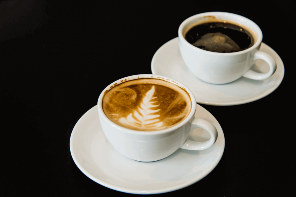 An Americano and a latte, showing the color difference from the milk