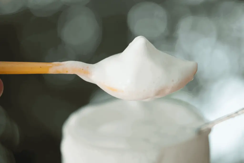 A close up of thick, rich milk froth, what you'd expect from the best milks for frothing