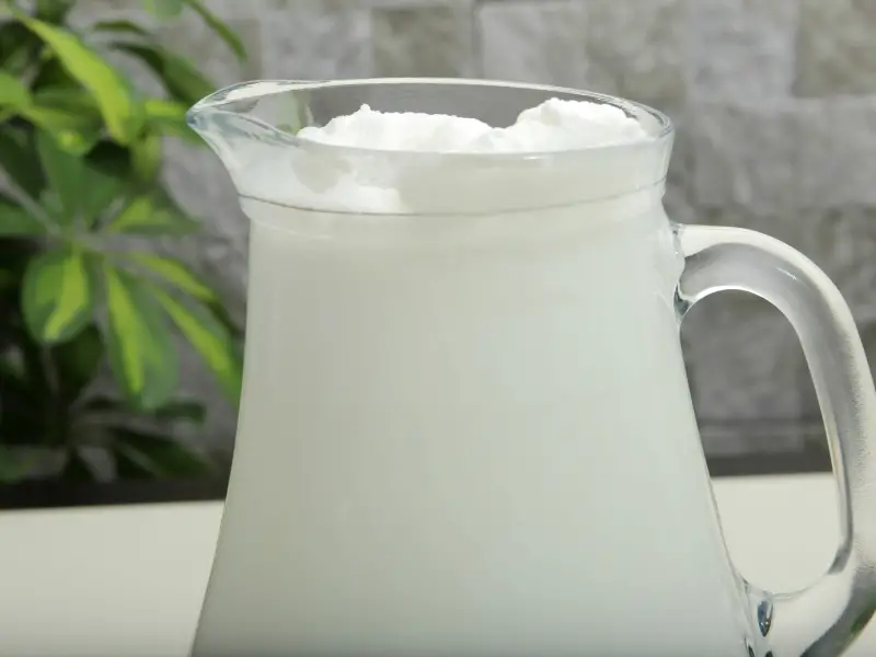 A pitcher of buttermilk, which some people add to coffee